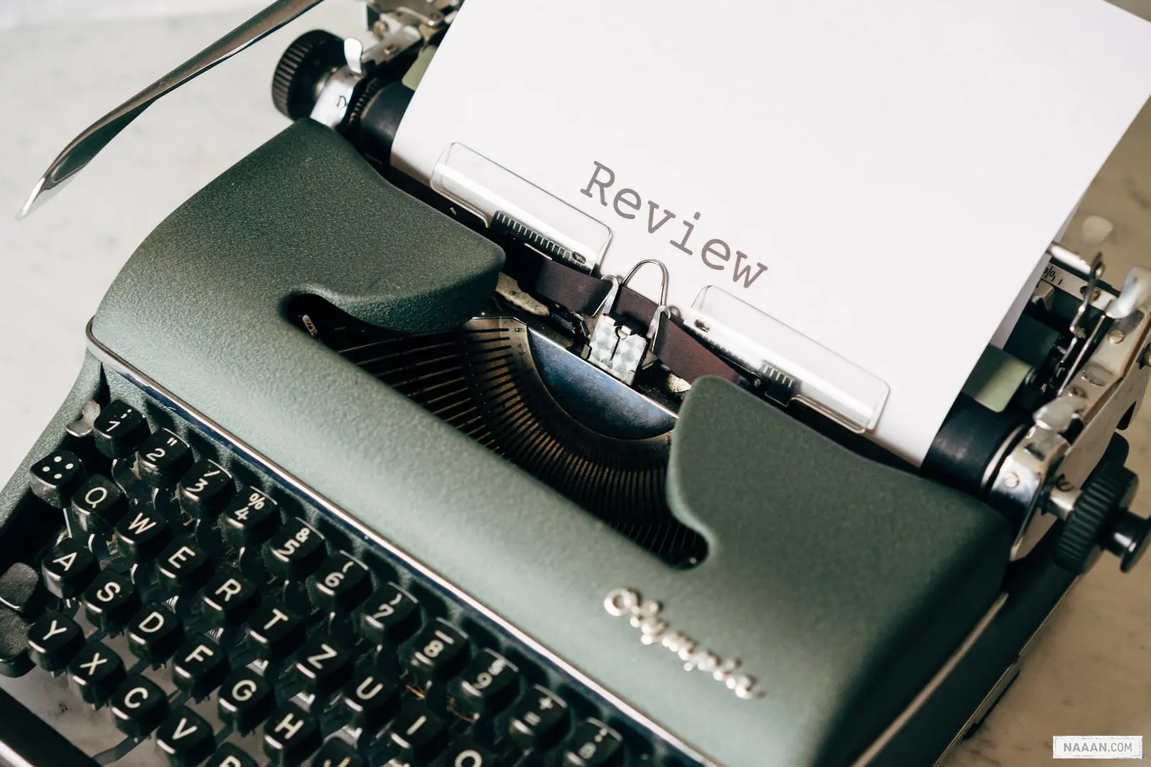 black and white typewriter on white table